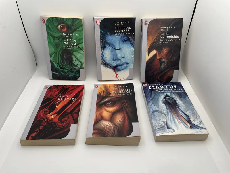 Le Trône de Fer - Tomes 7 à 12 (L'Épée de feu, Les Noces pourpres, La Loi du régicide, Le Chaos, Les Sables de Dorne, Un festin pour les corbeaux) - George R. R. Martin - J'Ai Lu - Livres - Très bon état