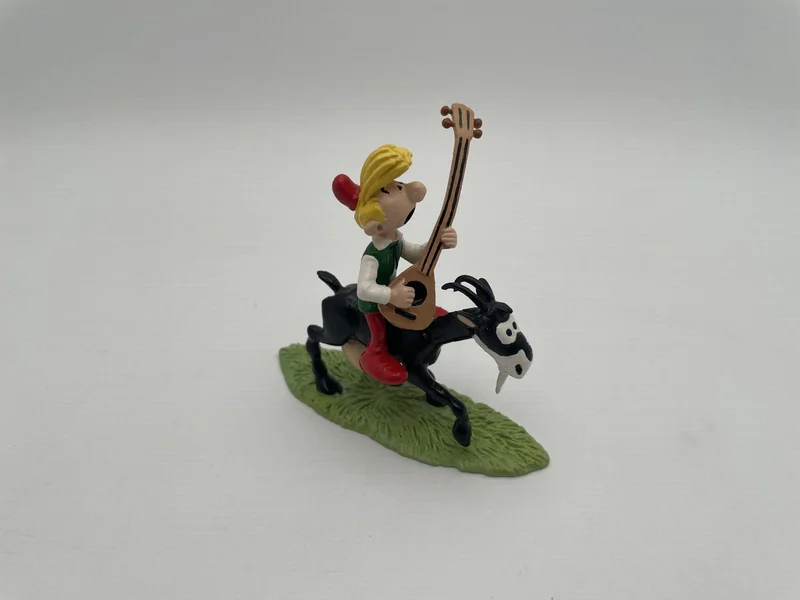 Pirlouit jouant de la guitare à cheval sur biquette - Pixi - Figurines - Très bon état