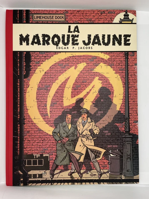 Sixième aventure de Blake et Mortimer, La Marque Jaune plonge le capitaine Blake et le professeur Mortimer dans un Londres nocturne terrorisé par un mystérieux insaisissable qui signe ses forfaits d'un M jaune. Edgar P. Jacobs y noue une intrigue