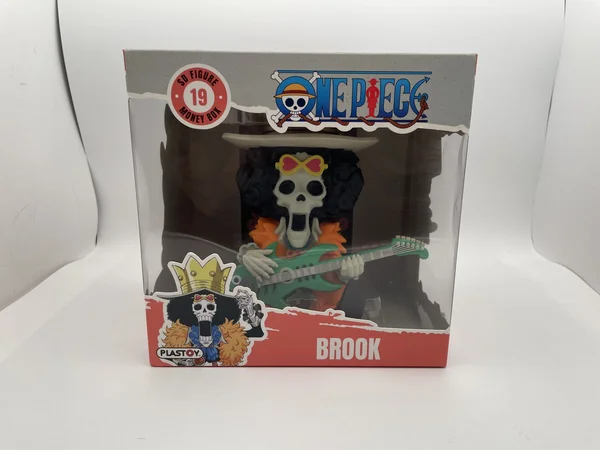 One Piece est le manga-fleuve d'Eiichiro Oda qui suit Monkey D. Luffy et son équipage de pirates dans leur quête du trésor légendaire. Brook, le musicien squelette du Chapeau de Paille, est représenté ici dans son costume de Soul King — guitare verte en